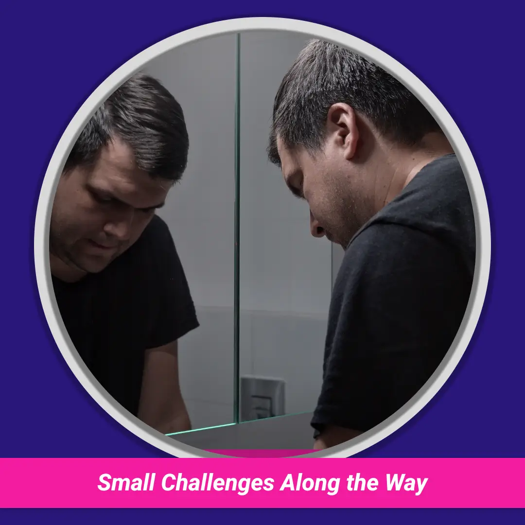 Small Challenges Along the Way: man looking down in a bathroom mirror